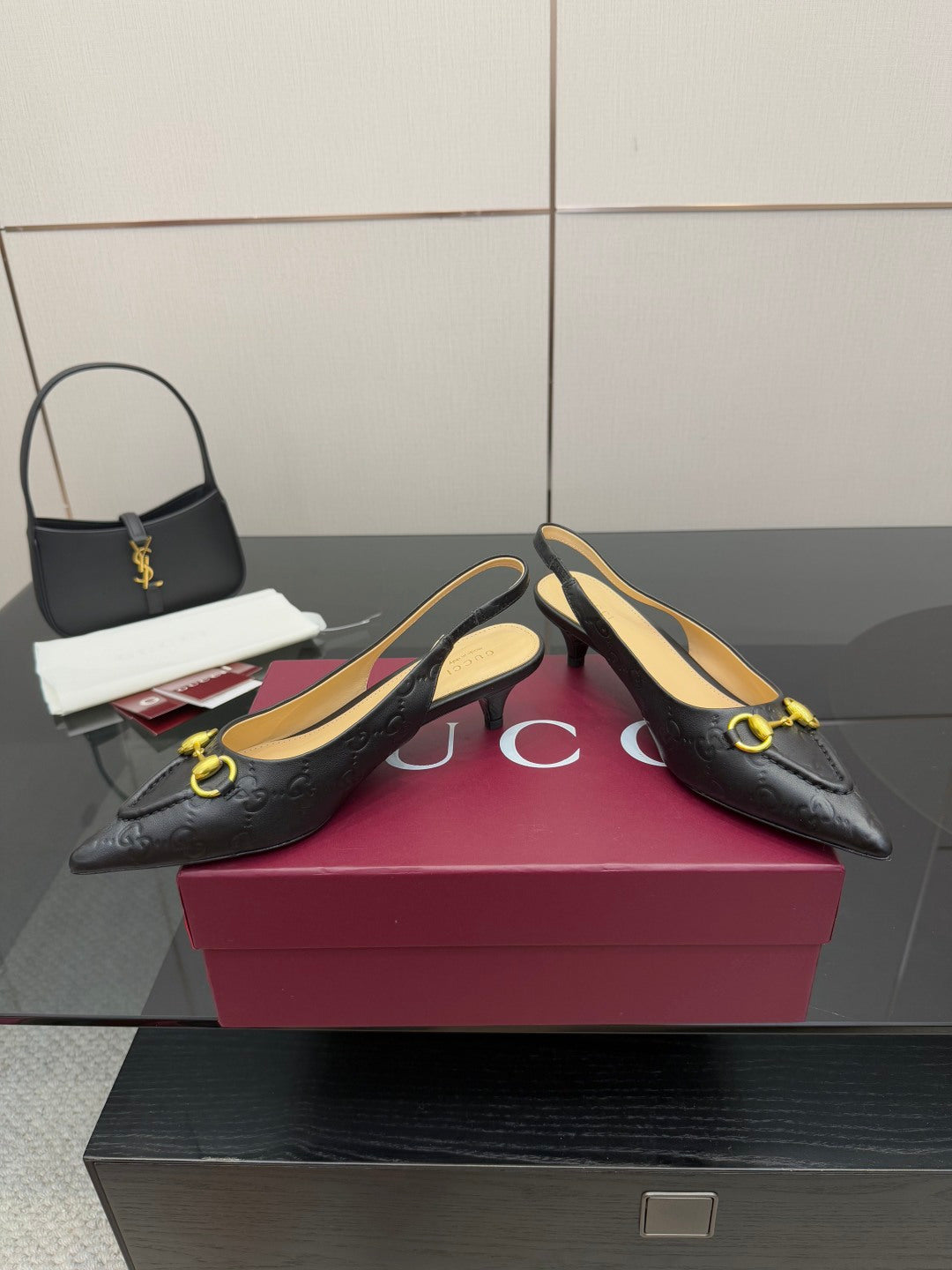 Women's Gucci black slingback loafers with gold horsebit detail, low heel