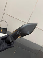 Women's Gucci black loafer with gold horsebit, close-up of upper