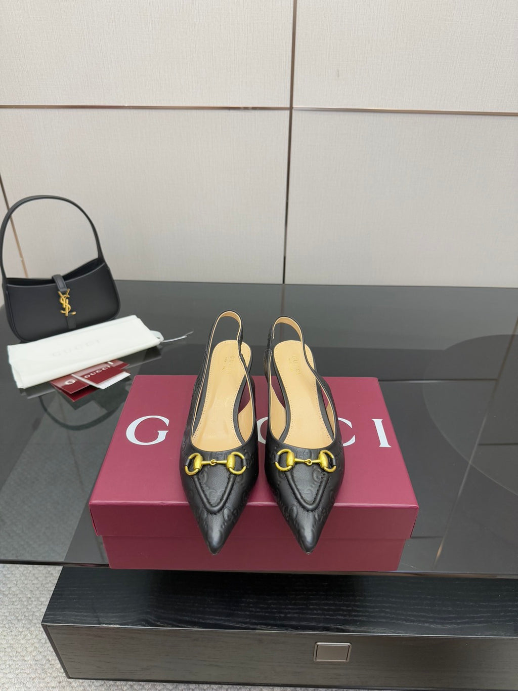 Women's Gucci black loafers with gold horsebit hardware