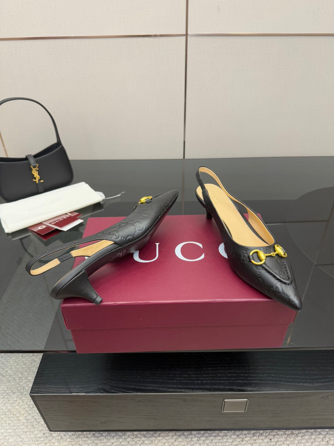 Women's Gucci black loafers with gold horsebit detail, pointed toe