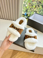 Balenciaga shearling slide sandals, white plush slides with brown suede strap; hand hold