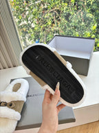 Balenciaga women’s sherpa sandals with textured outsole visible, tan suede strap