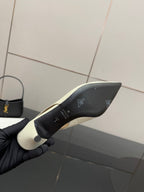 Shoe outsole underside with logo marks, showing heel and traction