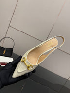 Cream slingback flat pump with gold horsebit and curved strap