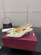 Cream slingback pumps with gold horsebit and slim heel