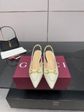 Cream pointed-toe low heel shoes with gold horsebit detail