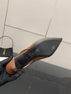 Slingback heel insole view with dark lining and Gucci logo at toe area