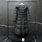 Moncler long puffer coat, dark gray, three-quarter view with hood and quilted panels
