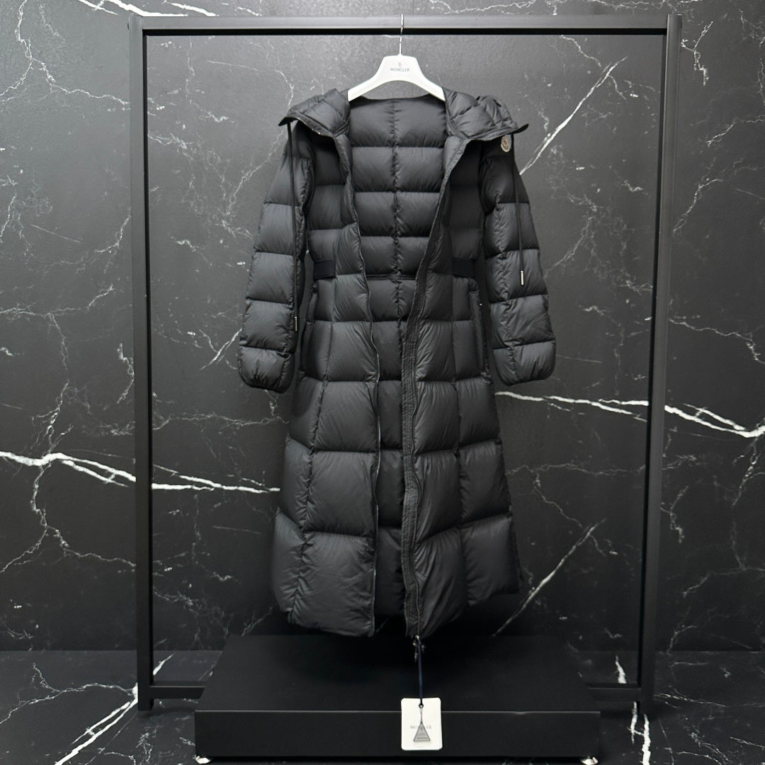 Moncler long puffer coat, dark gray, three-quarter view with hood and quilted panels