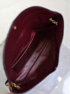 YSL burgundy leather-style shoulder bag interior with gold chain detail