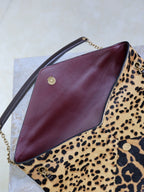 YSL leopard-print shoulder bag with burgundy interior panel and gold hardware