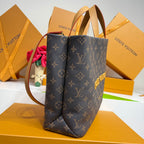 Dark blue monogram tote bag with structured sides and dual top handles