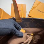 Dark blue monogram tote bag interior view with zipper and gold zipper pull