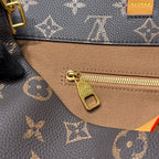Louis Vuitton monogram bag zipper pull and gold zipper