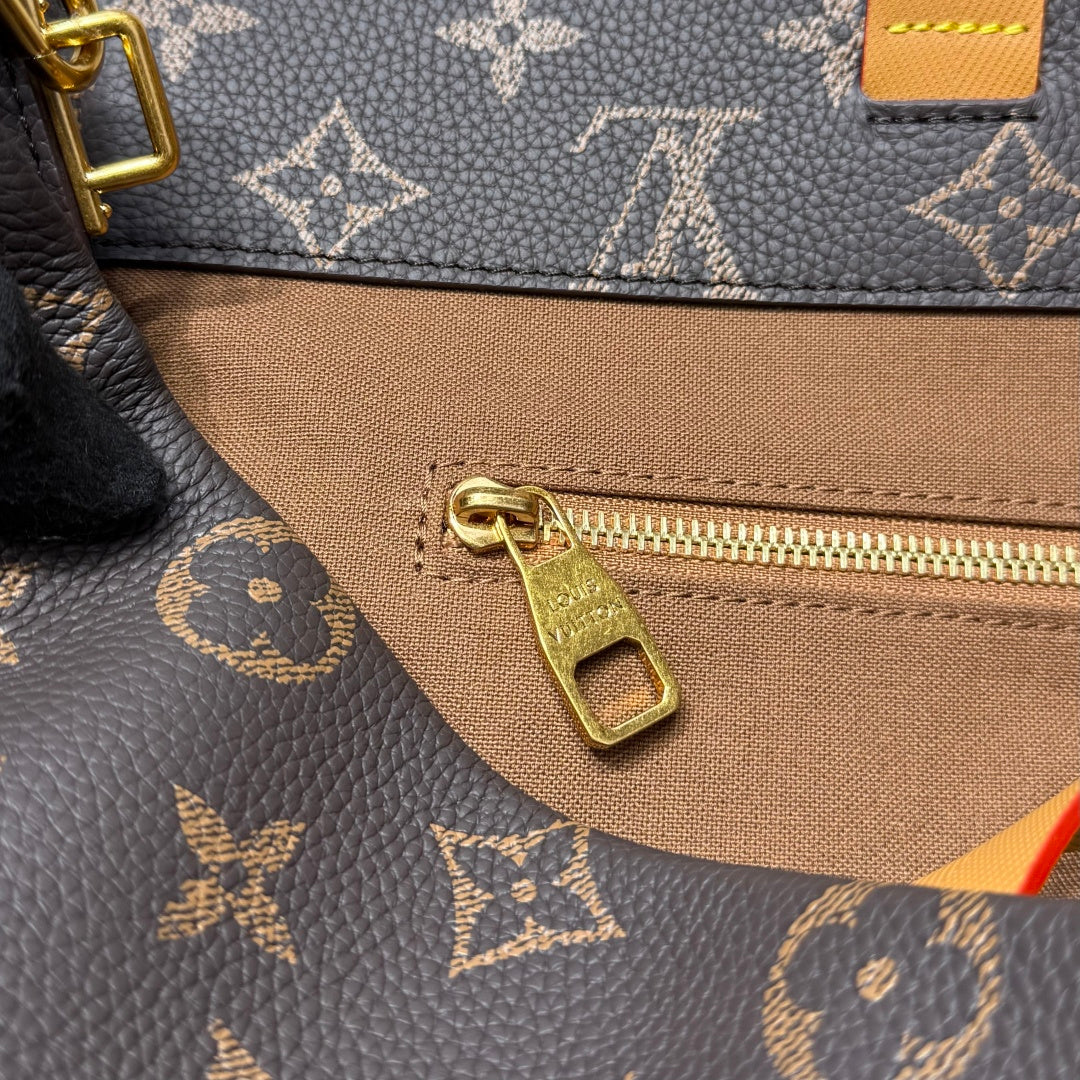 Louis Vuitton monogram bag zipper pull and gold zipper