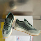 Moncler lace-up sneakers in sage and dark green, textured sole edge and side branding