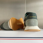 Moncler sneakers viewed from side and heel, sage and dark green with textured sole