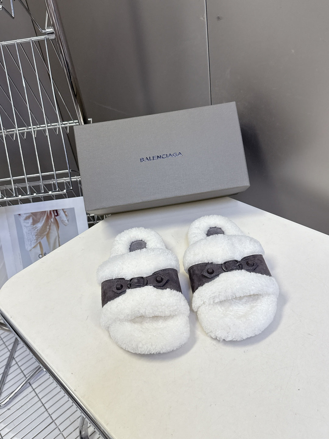 Faux shearling slide sandals with dark ankle strap and open toe, white