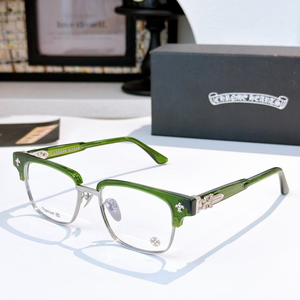 Green eyeglasses with clear lenses and metal rims, decorative bridge