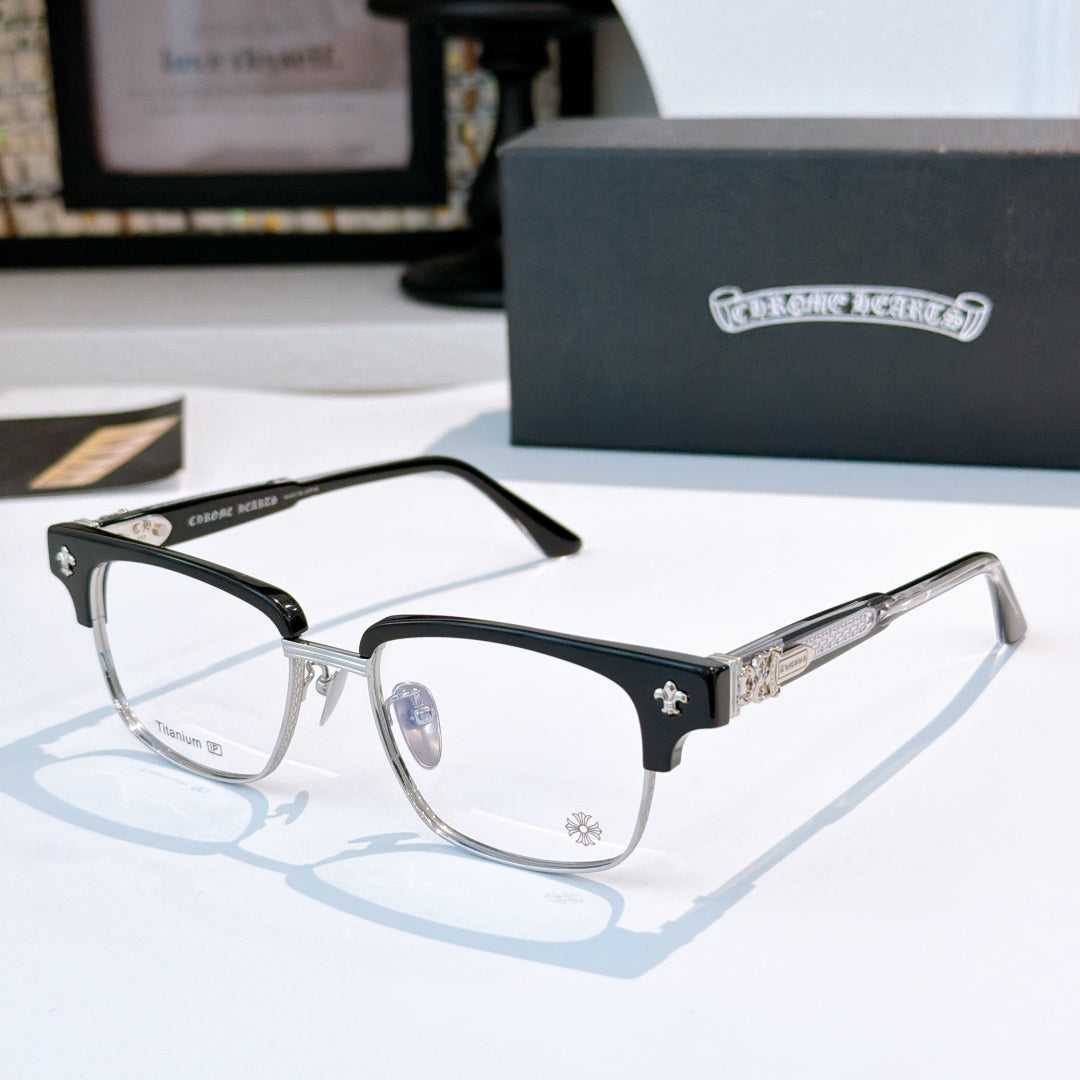 Black eyeglasses with clear lenses, silver bridge and star detail