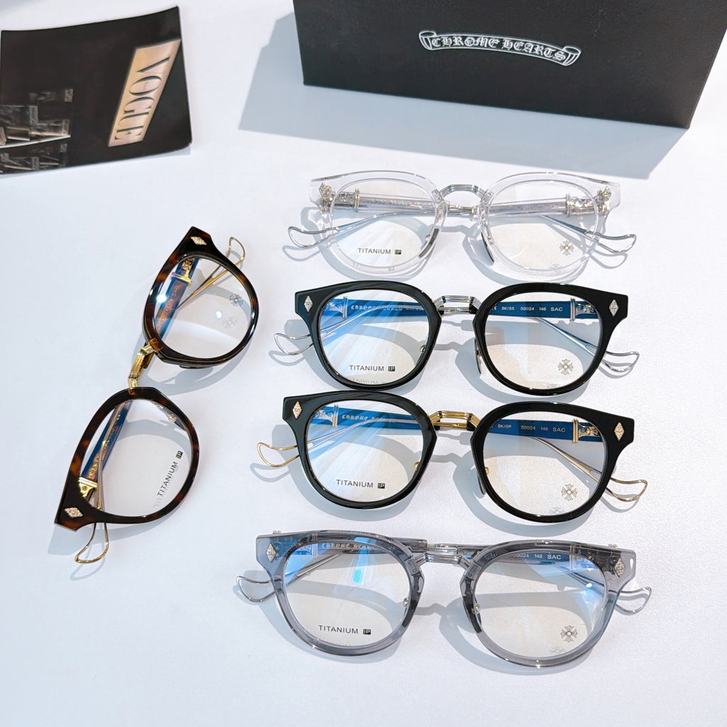 Set of multiple eyeglass frames in clear, black, and blue-tinted lenses on display.