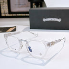 Clear round-frame glasses with clear lenses and transparent arms; metal hinge detail.