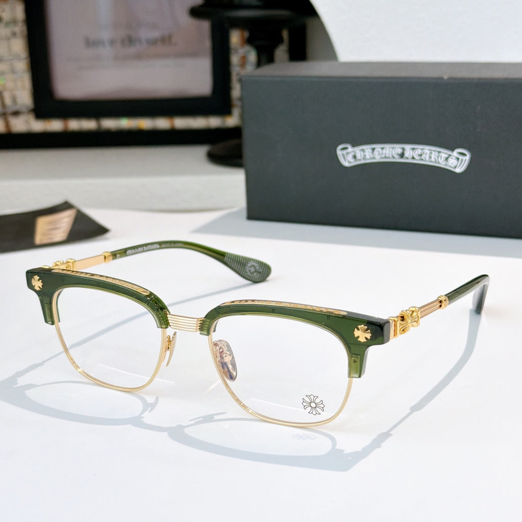 Chrome glasses with clear lenses, green acetate frame with gold-tone arms and star accents