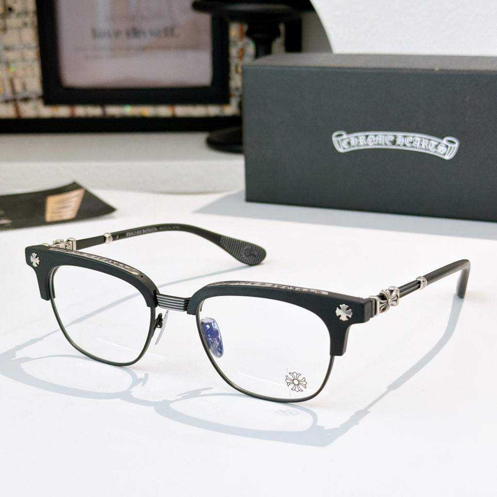 Chrome glasses with clear lenses, dark frame, silver-tone arms and blue temple accents