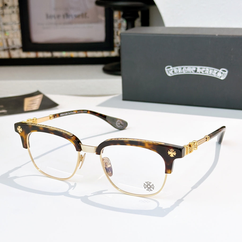 Chrome glasses with clear lenses, tortoise frame, gold-tone arms and star accents