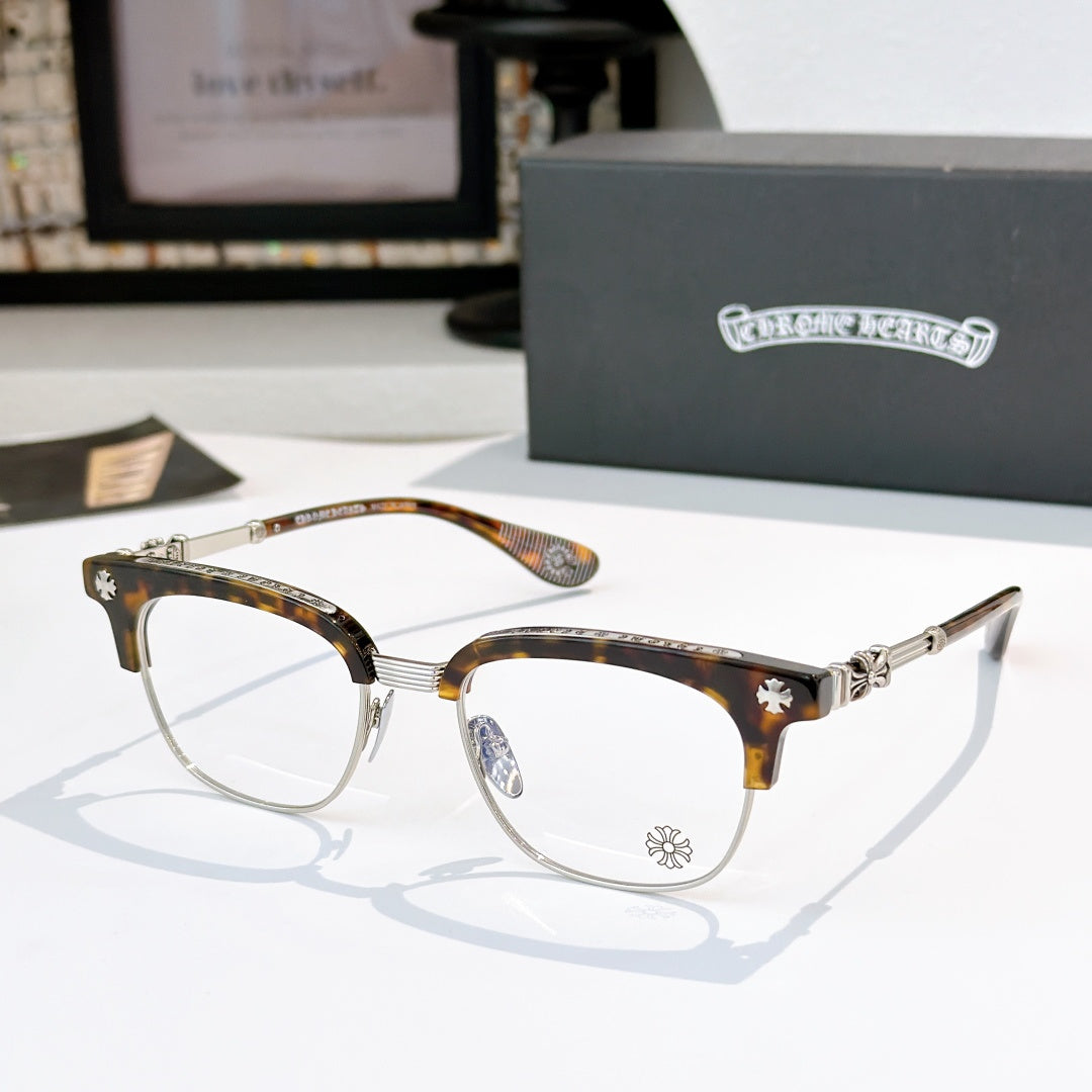 Chrome glasses with clear lenses, tortoise frame with gold-tone arms and star detail