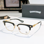 Chrome glasses with clear lenses, black frame with gold-tone details and star accents