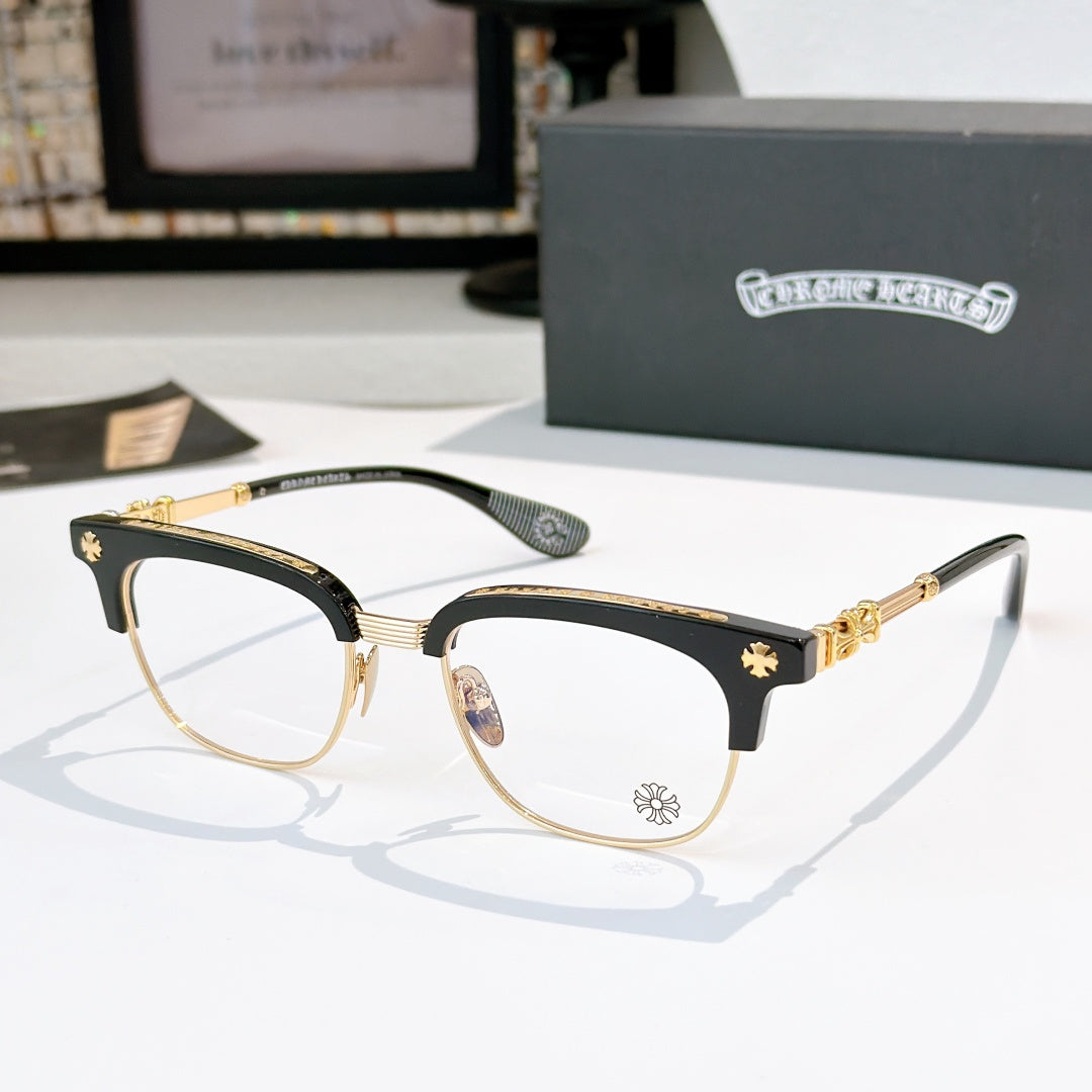 Chrome glasses with clear lenses, black frame with gold-tone details and star accents