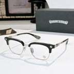 Chrome glasses with clear lenses, black frame with silver-tone arms and star detail on temples