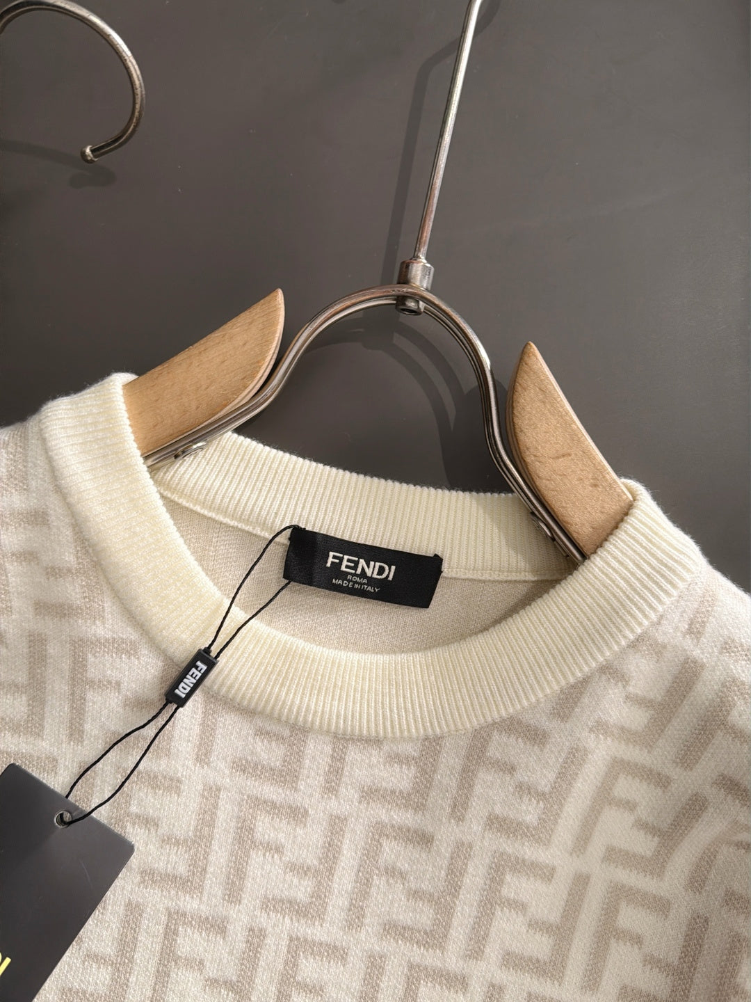 Cream sweater neckline with ribbed collar and Fendi FF pattern, hanging label
