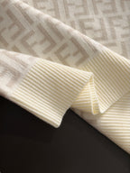Cream sweater cuff and hem with ribbed knit and Fendi FF pattern