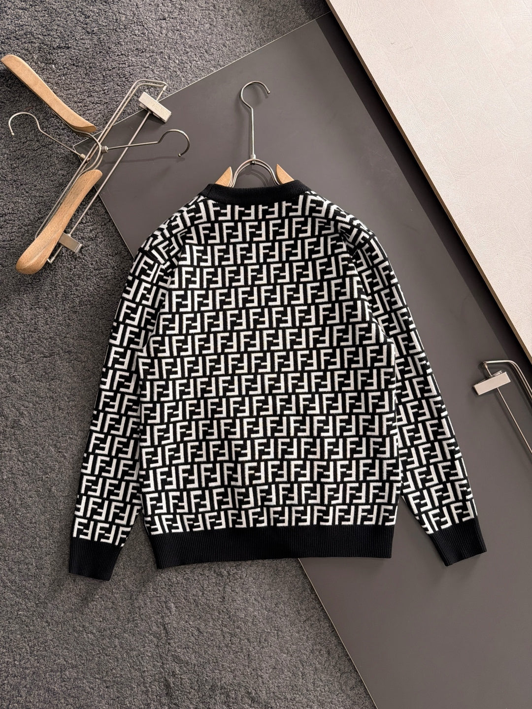 Fendi long-sleeve knit top, black with white FF logo pattern and ribbed hem