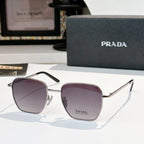 Sunglasses with square purple tinted lenses and silver frame