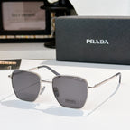 Sunglasses with square dark gray tinted lenses and silver frame