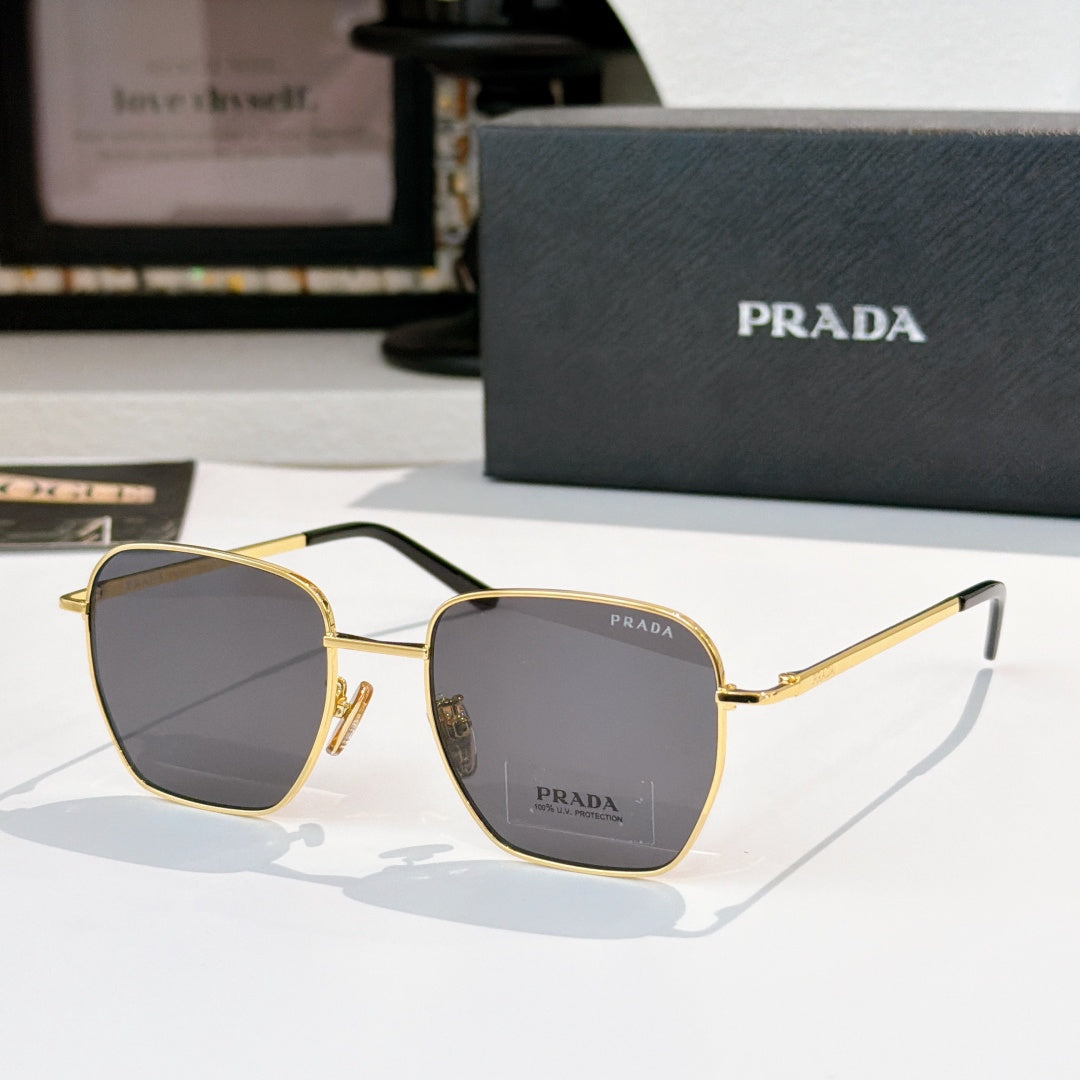 Sunglasses with square gray tinted lenses and gold frame