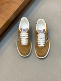 Tan suede sneakers with white laces and blue check panel detail