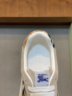 Burberry logo insole with blue graphic on tan sneaker lining