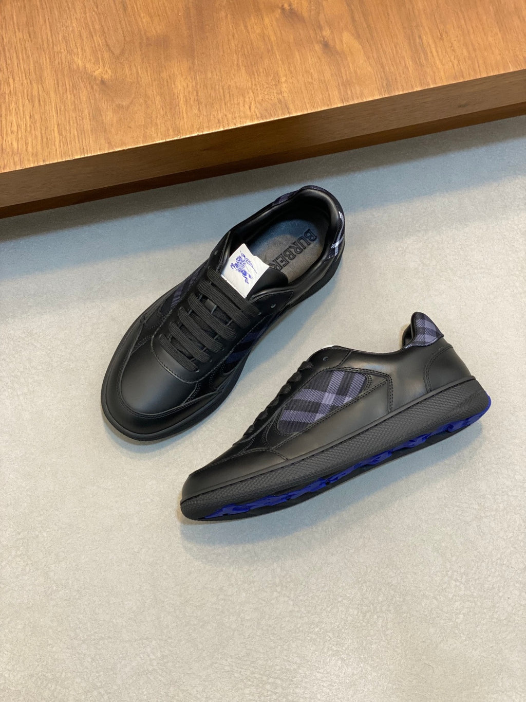 Burberry sneakers, dark leather with blue plaid tongue, lace-up, blue-trim sole