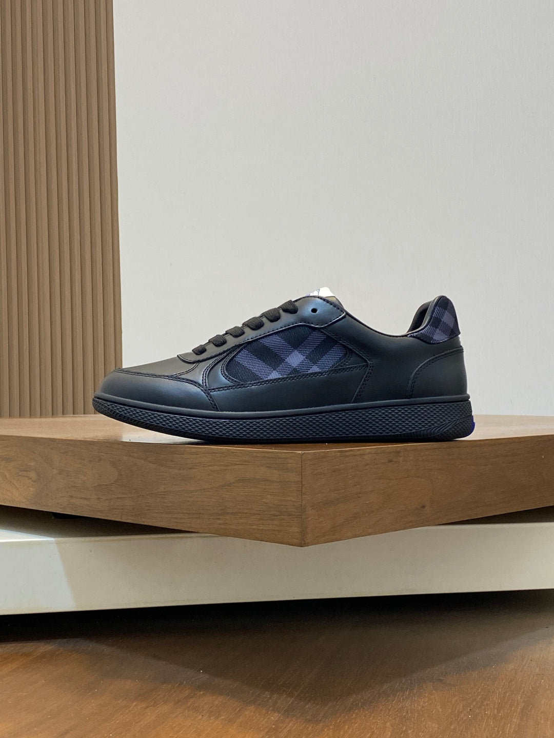 Burberry low-top sneakers with blue plaid lining, lace-up front, dark leather