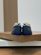 Burberry low-top sneakers back view, blue heel with textured blue sole