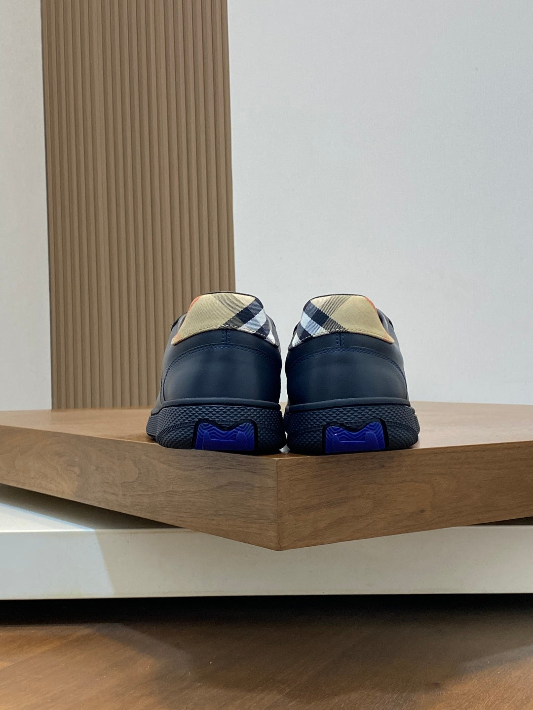 Burberry low-top sneakers back view, blue heel with textured blue sole