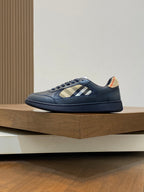 Burberry low-top sneakers side view, blue leather with beige check strap