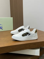 White lace-up sneakers with plaid side detail and cushioned low-profile sole.