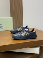 Burberry low-top sneakers on display platform, blue upper with beige check detail