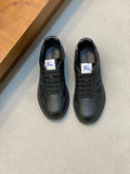 Burberry lace-up sneakers in dark leather with blue plaid panels and rubber sole