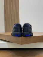 Burberry sneakers with blue heel accents, dark leather, lace-up rear view